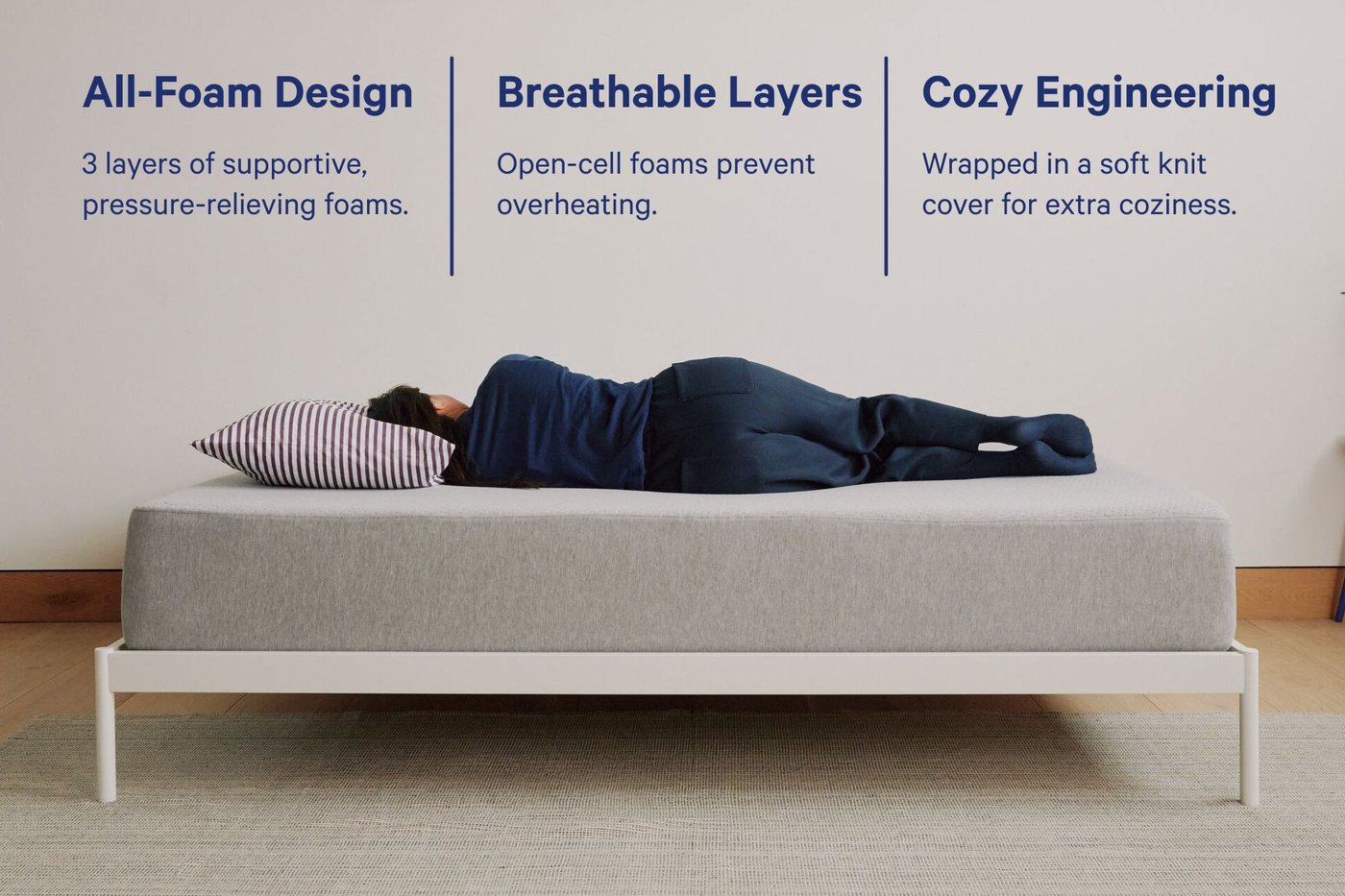 Hand pressing into the surface of the Casper One mattress