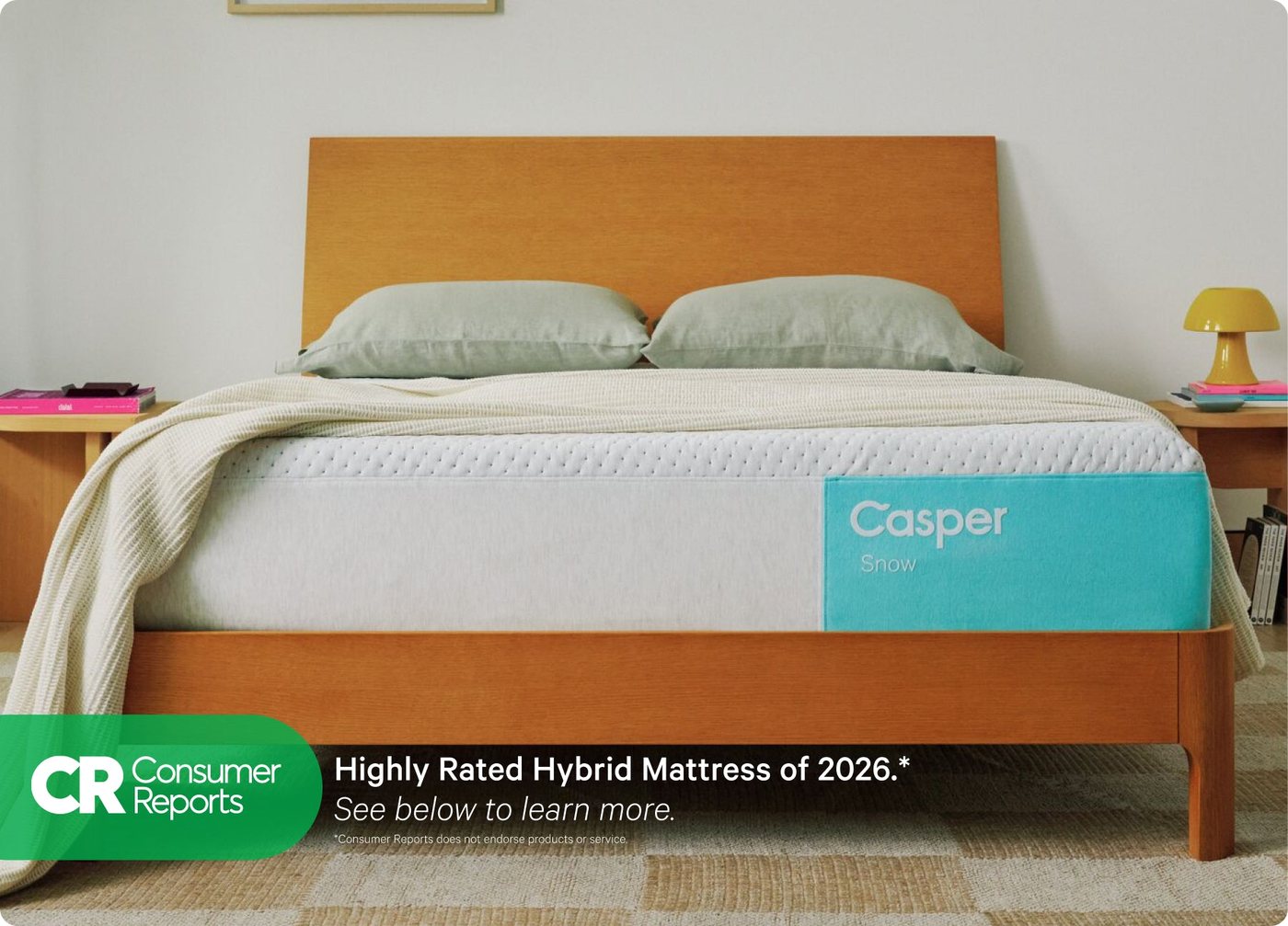 Couple lying on a Casper Snow Hybrid mattress