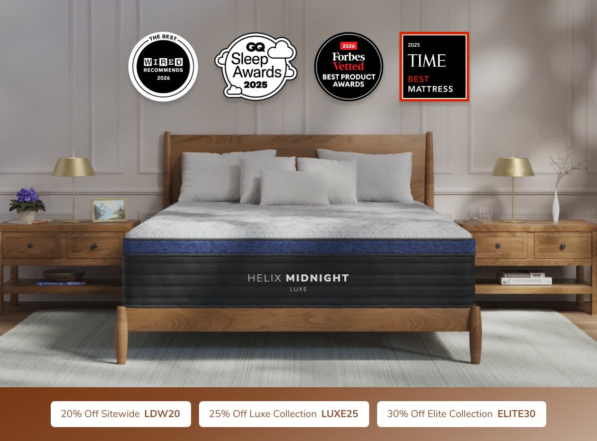 Helix Midnight Luxe mattress styled on a wooden bed frame