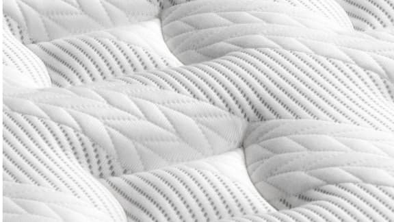 Cutaway detail of the Leesa Sapira Chill Hybrid showing its foam layers and zoned springs