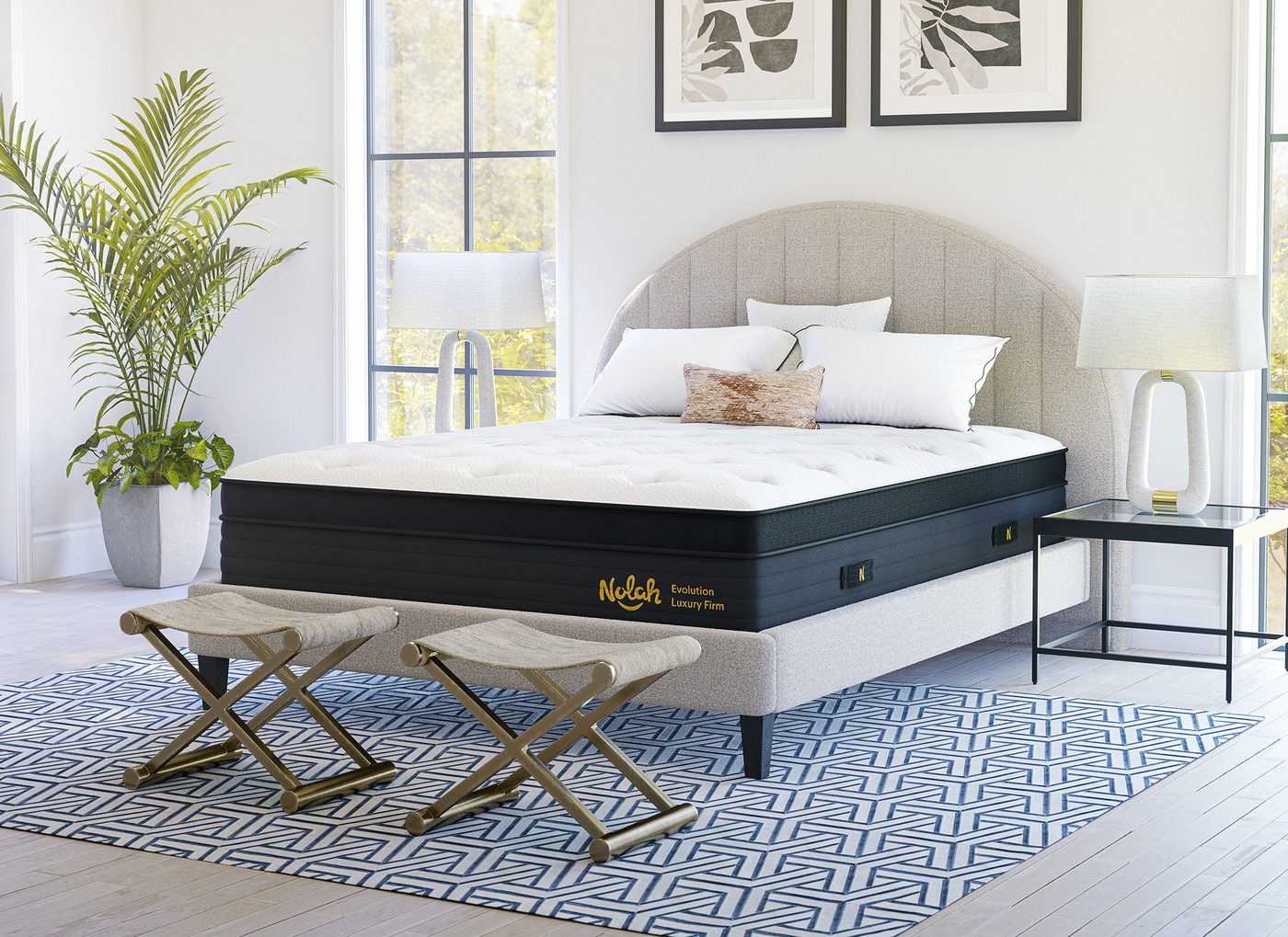 Nolah Evolution 15 mattress on an upholstered bed frame in a bright bedroom