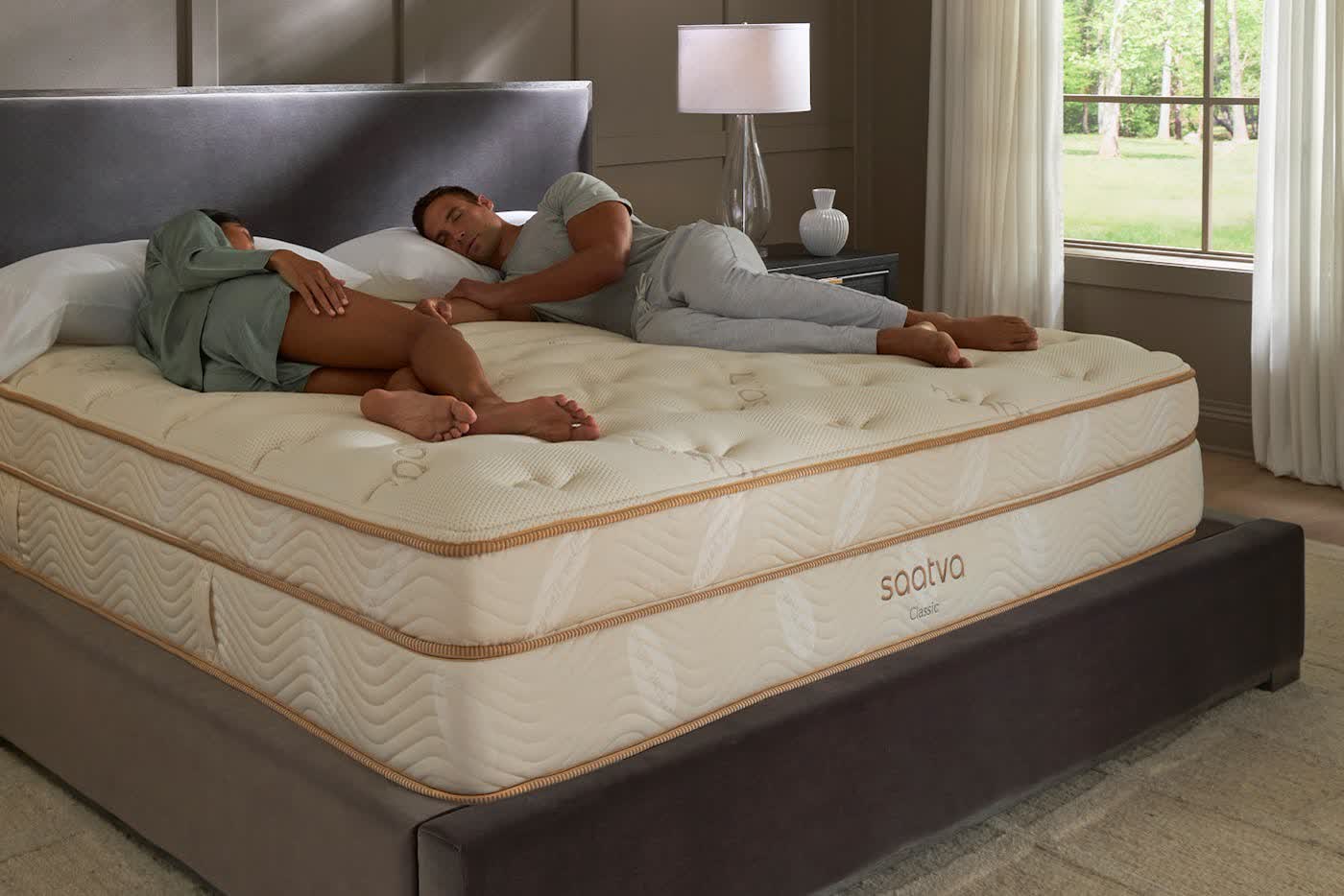 Two sleepers resting on the Saatva Classic innerspring mattress