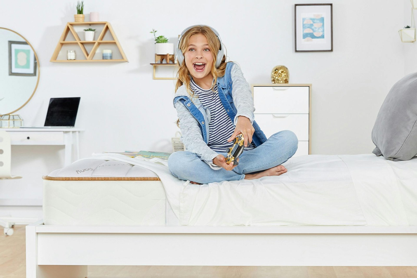 Saatva Youth mattress styled in a bedroom