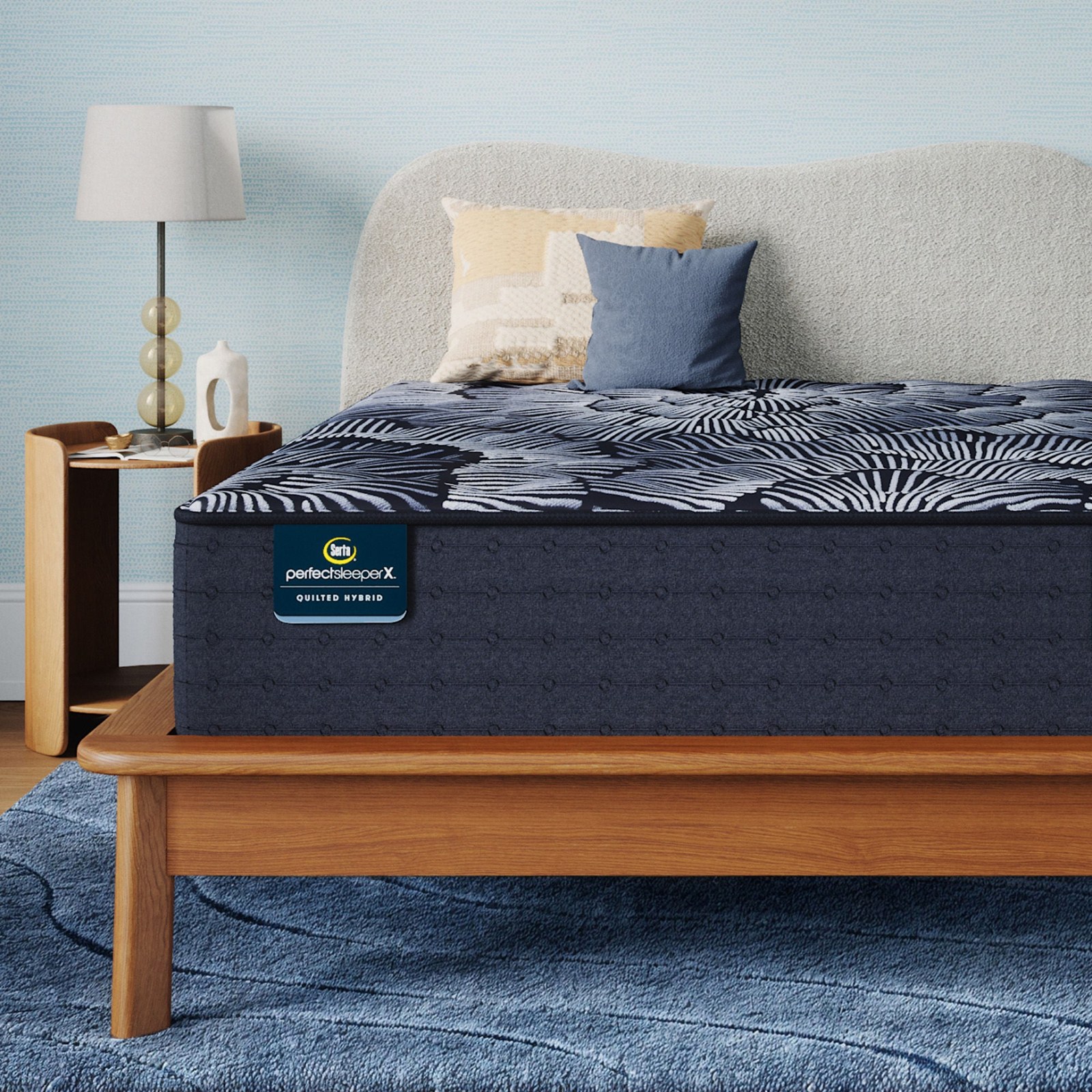 Close view of the Serta Perfect Sleeper X Quilted Hybrid Level One cover and comfort layers