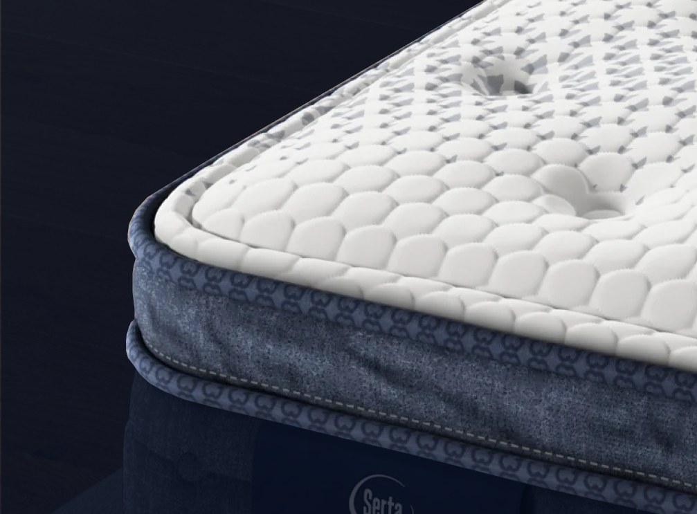 Serta Perfect Sleeper X Quilted Hybrid Level One mattress styled in a bedroom